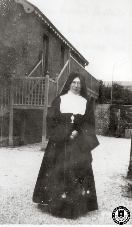 Sister-M-Edward-in-front-of-Priest\'s-cottage 1930