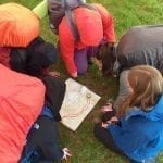 bronze dofe looking at map 2019