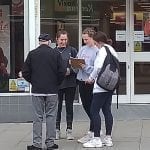 Year 10 Geography students at Calshot asking people Questionnaires to find out about the area.